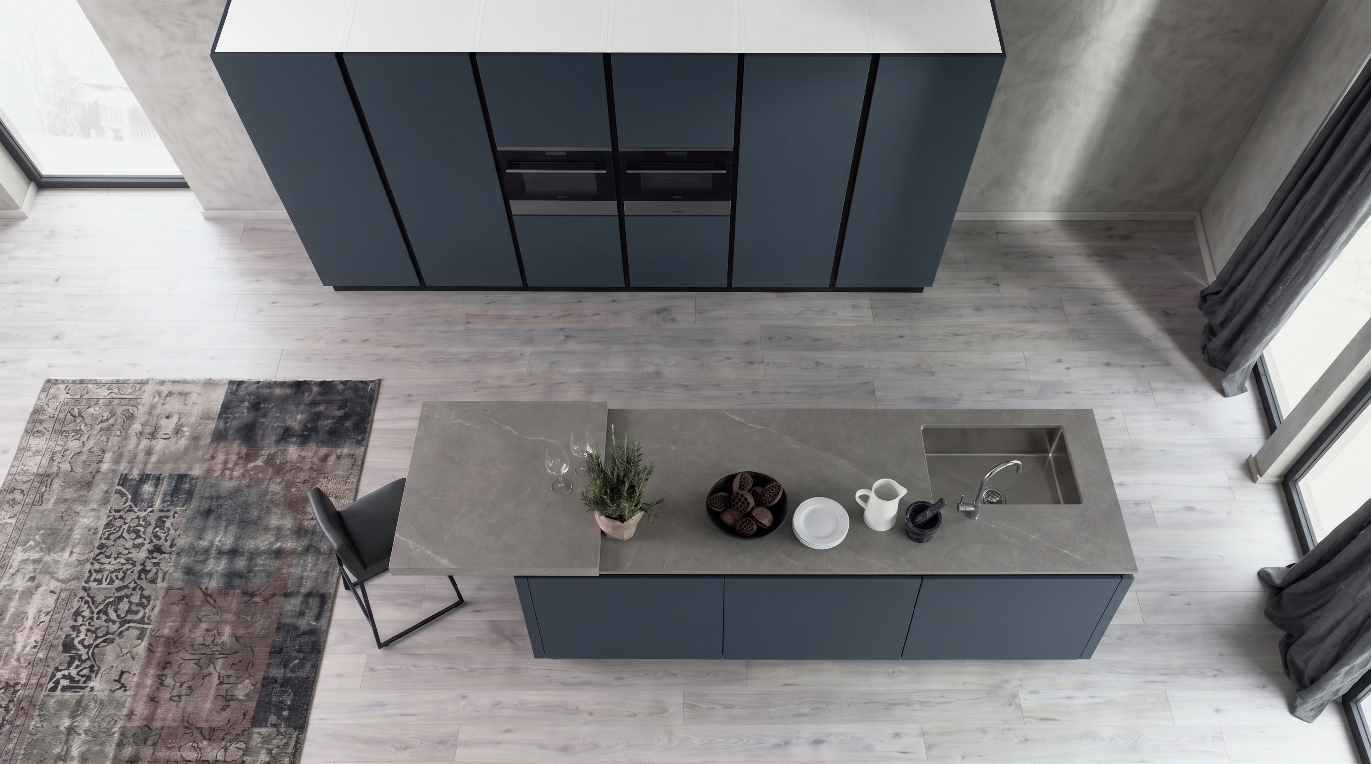 Gacaferi Indigo kitchen with matte dark cabinetry and stone island